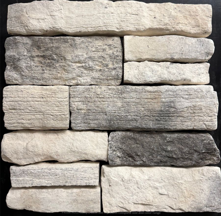 Country Ledge – Tulsa sample board. Cream and light gray pieces with a weathered, striated face.