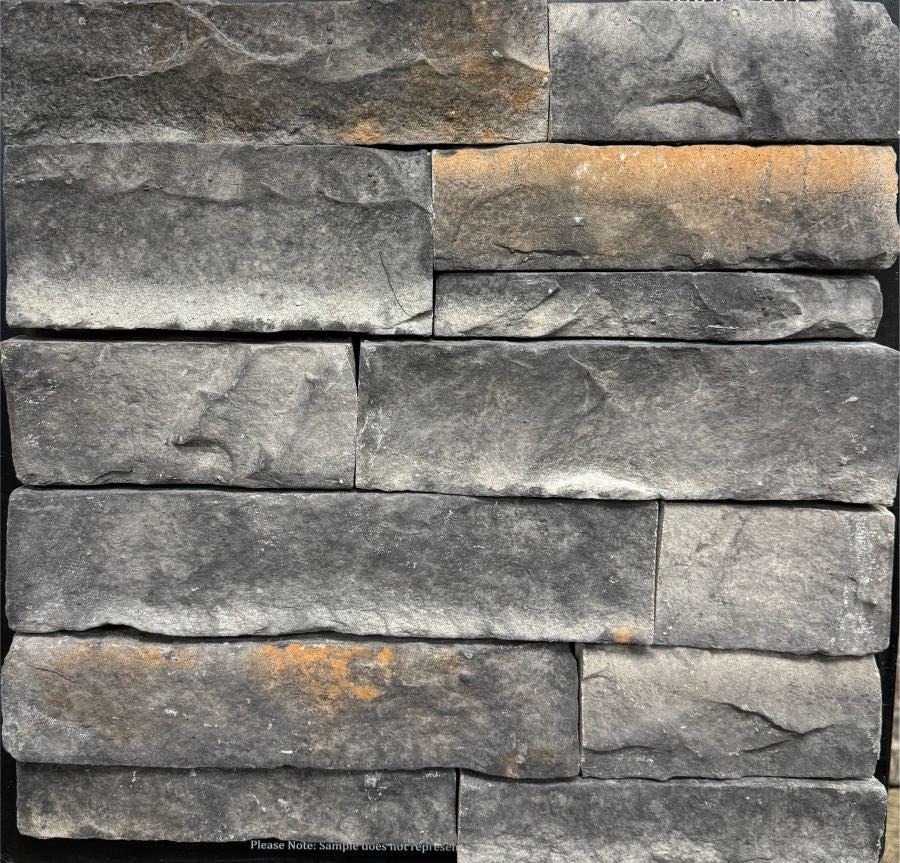 Ledge – Dark Night sample board. Dark gray ledge pieces with rust highlights and a split face.