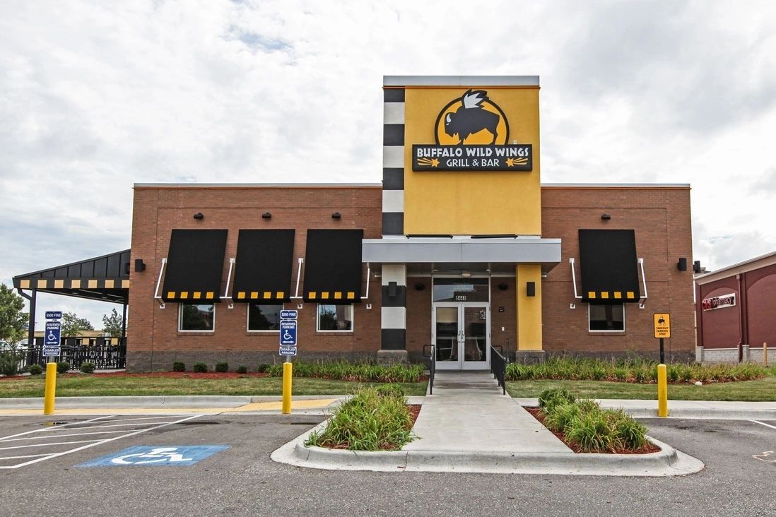 Restaurant exterior with stone veneer wainscot and columns, Kansas City area