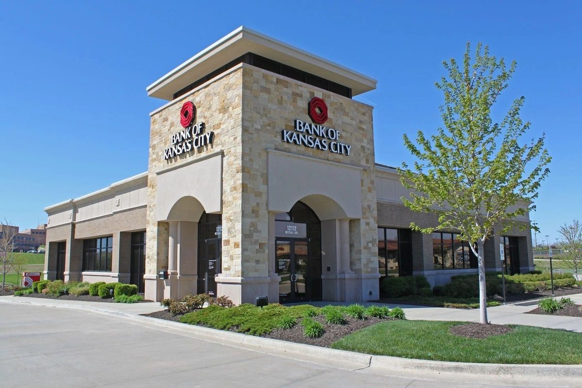 Restaurant with a cream stone veneer facade and tower, Kansas City area