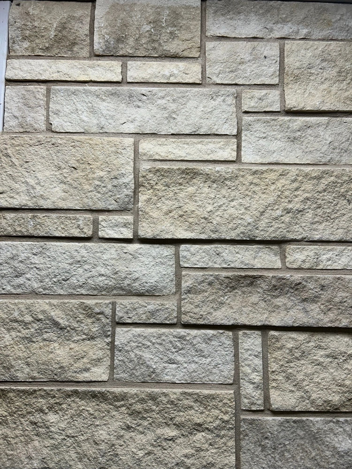 Dimensional natural stone veneer, Cottonwood, installed