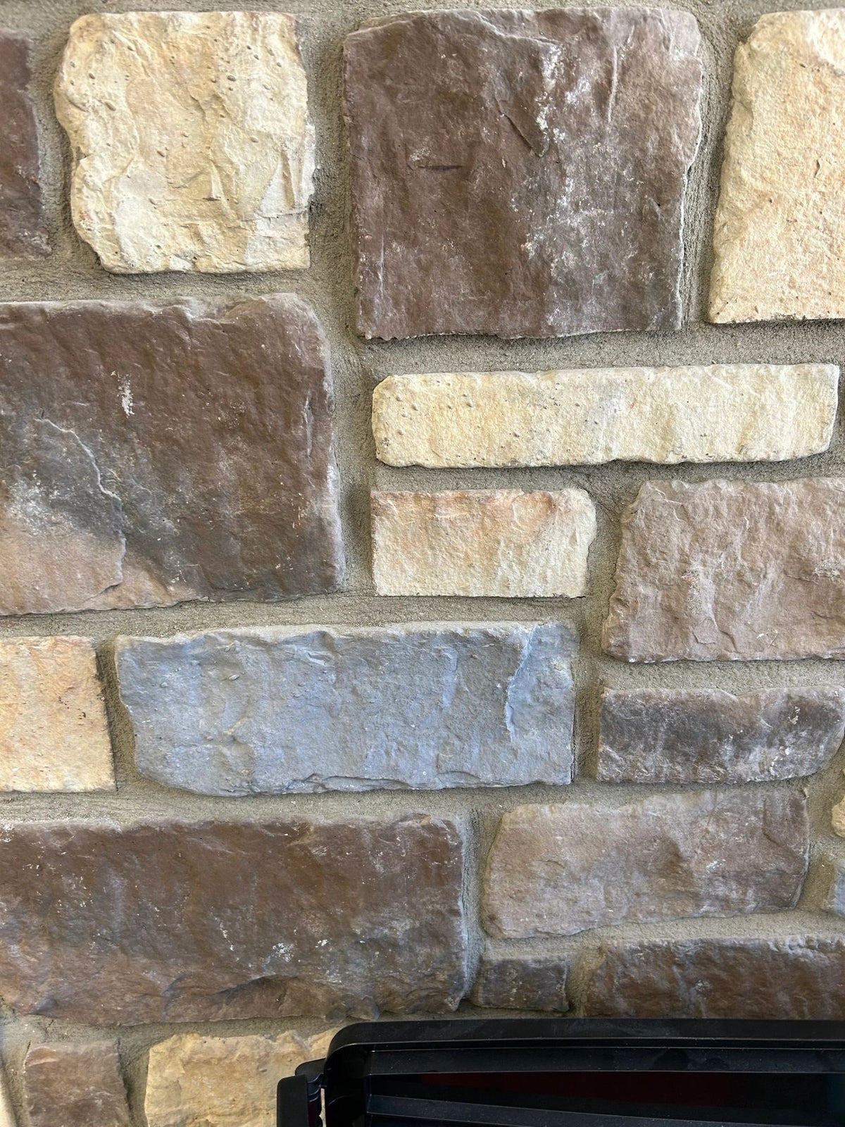 Tumbled manufactured stone veneer, San Francisco, installed