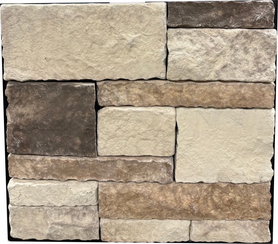 Ashlar – Desert Cream sample board. Cream and buff blocks with brown accent pieces and tumbled edges.