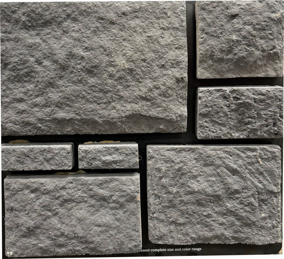 Castle – Charcoal sample board. Uniform dark charcoal gray with a heavy rock face.
