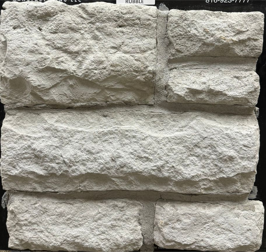 Coastal – Rubble sample board. Light gray rubble with a deeply textured, rough-hewn face.