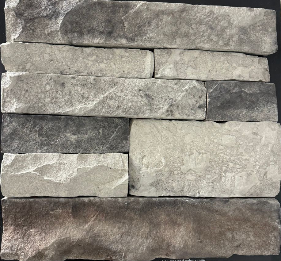 Ledge – Norris Gray sample board. Light gray and white ledge pieces with charcoal shading and a dark accent piece.