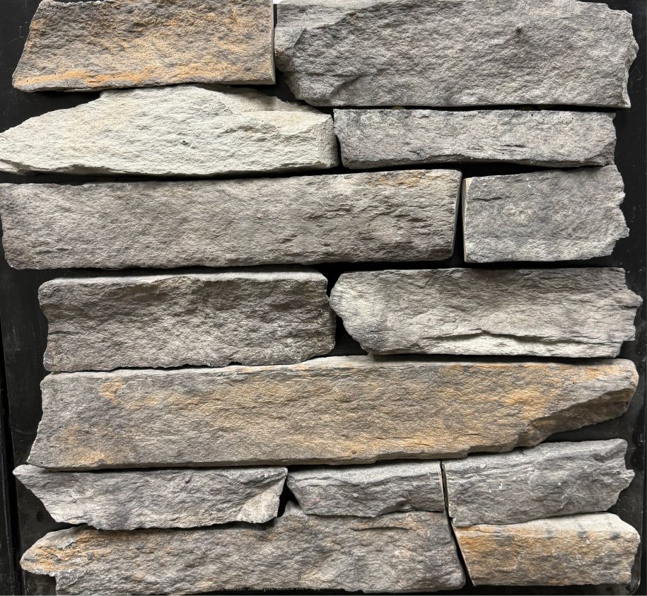 Southern Ledge – Dark Night sample board. Gray pieces with rust highlights and a natural cleft face.