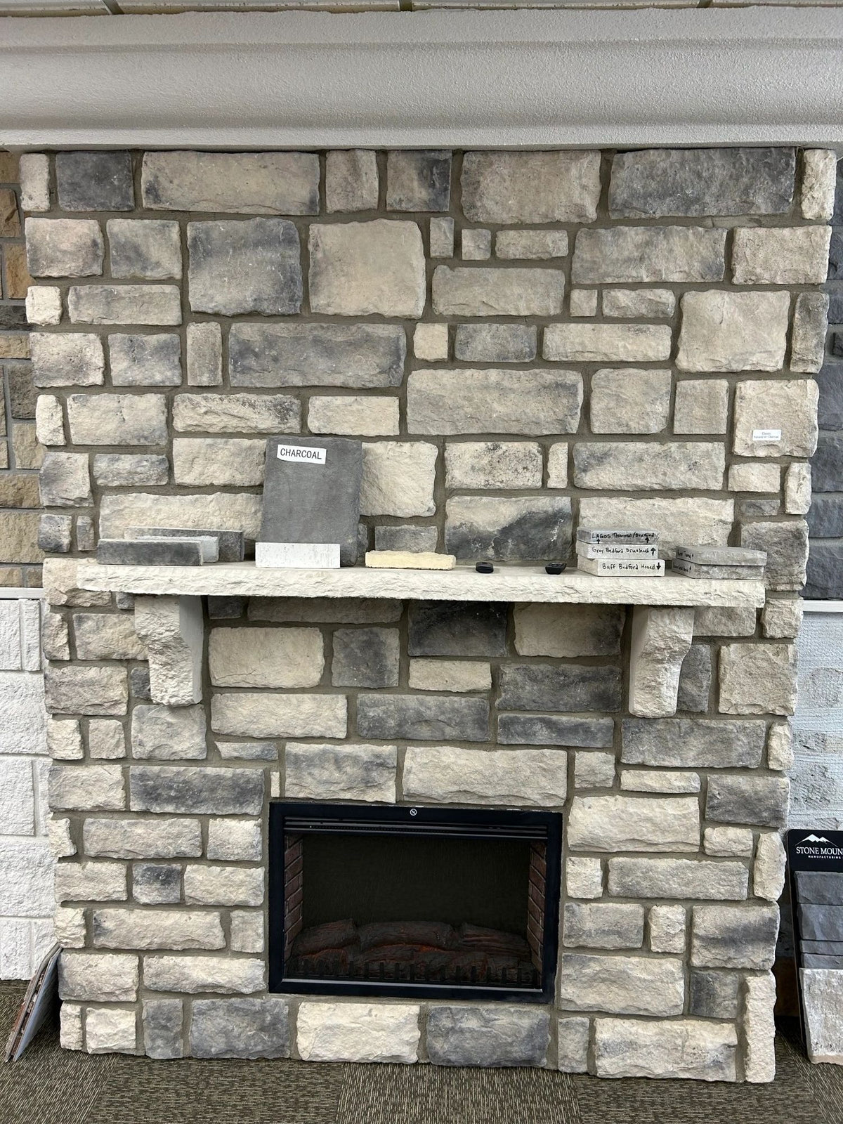 Fireplace surround in Classic manufactured stone veneer, Natural with Charcoal