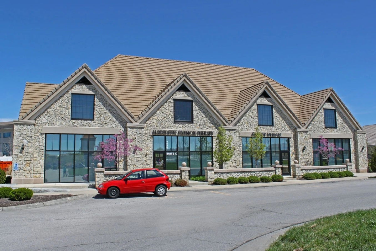 Retail center with stone veneer gables and columns, Kansas City area