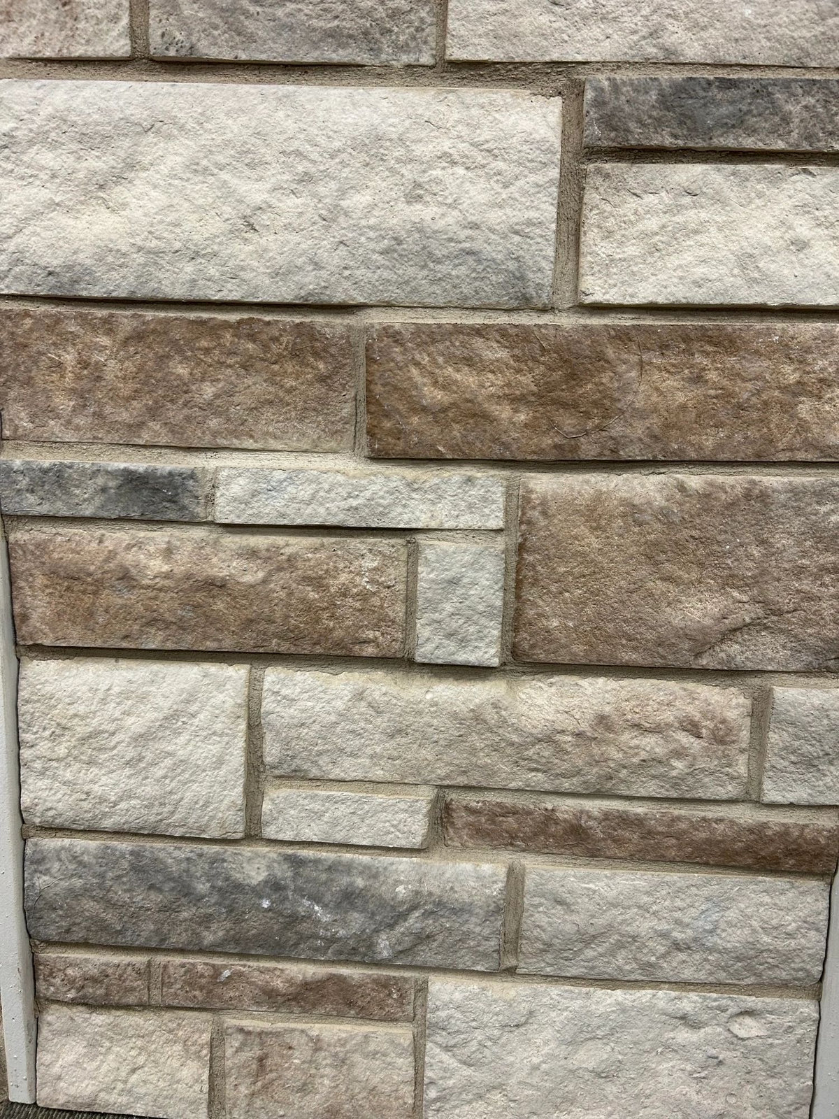 Limestone-look manufactured stone veneer, Natural Blend, installed